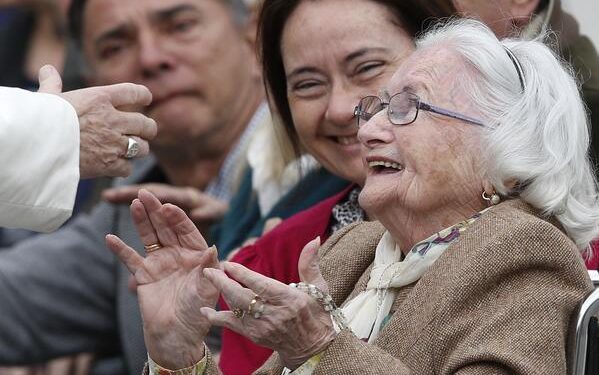 An elderly woman reacts as she meets Pope Francis during his general audience in St. Peter's Square at the Vatican in this March 22, 2017, file photo. The pope has chosen the theme "I am with you always," for the first World Day for Grandparents and the Elderly, to be celebrated July 25. (CNS photo/Paul Haring)